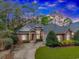 Traditional brick home with lush lawn, mature trees and long driveway at 25 Berwick Dr., Pawleys Island, SC 29585