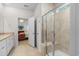 Bathroom featuring a shower with glass door and a view into the primary bedroom at 2568 Goldfinch Dr., Myrtle Beach, SC 29577