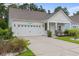 Inviting single-story home showcasing a manicured lawn and a pristine two-car garage at 2568 Goldfinch Dr., Myrtle Beach, SC 29577