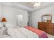 Main bedroom featuring wood furniture, tray ceilings, and ensuite bathroom at 2568 Goldfinch Dr., Myrtle Beach, SC 29577