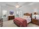 Main bedroom with tray ceilings, ceiling fan, ensuite bathroom and neutral walls at 2568 Goldfinch Dr., Myrtle Beach, SC 29577