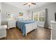 Cozy bedroom with a queen bed, white furniture, and a window view at 301 Lumbee Circle, Pawleys Island, SC 29585