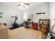 Functional bedroom with exercise equipment, desk, guitar, and lots of natural light at 301 Lumbee Circle, Pawleys Island, SC 29585