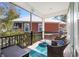 Relaxing porch with comfortable wicker chairs and a view of the backyard at 301 Lumbee Circle, Pawleys Island, SC 29585