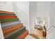 Colorful stairway leading to a living room with a comfortable couch and lots of light at 301 Lumbee Circle, Pawleys Island, SC 29585