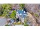 Aerial view of the stunning residence nestled among mature trees on a picturesque lot at 3369 Collins Creek Dr., Murrells Inlet, SC 29576