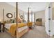 Spacious bedroom featuring two four-poster beds with ceiling fan and lots of natural light at 3369 Collins Creek Dr., Murrells Inlet, SC 29576