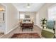 Bright bedroom with natural light, featuring a sitting area, area rug, and a large window at 3369 Collins Creek Dr., Murrells Inlet, SC 29576