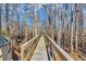 Scenic boardwalk winds through the peaceful woods, offering a tranquil escape at 3369 Collins Creek Dr., Murrells Inlet, SC 29576