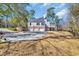 Stunning exterior elevation with brick accents and a sprawling driveway to three-car garage at 3369 Collins Creek Dr., Murrells Inlet, SC 29576