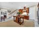 Kitchen area with a view of stairs and an island for food preparation at 3369 Collins Creek Dr., Murrells Inlet, SC 29576