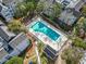 Aerial view of the community pool featuring palm trees and lounge area at 351 Lake Arrowhead Rd. # 2-206, Myrtle Beach, SC 29572