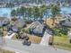 An aerial view of the property shows mature trees, lake views and a suburban neighborhood at 356 Carriage Lake Dr., Little River, SC 29566