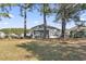 Expansive backyard with mature trees providing shade and privacy to the home at 356 Carriage Lake Dr., Little River, SC 29566