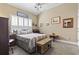 Bedroom with a ceiling fan, shutters, and natural-toned walls at 356 Carriage Lake Dr., Little River, SC 29566