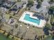 Aerial view of a community pool and recreational area, surrounded by landscaped grounds and residential homes at 356 Carriage Lake Dr., Little River, SC 29566