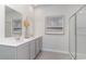 Modern bathroom featuring double sinks, neutral finishes, and a glass-enclosed shower at 365 Rookroost Circle, Conway, SC 29526