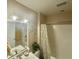 Bathroom featuring neutral walls, vanity with sink, mirror with sconces, shower, and floral shower curtain at 3677 Claypond Village Ln. # 4, Myrtle Beach, SC 29572