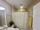 Bathroom featuring neutral walls, vanity with sink, mirror, shower, and floral shower curtain at 3677 Claypond Village Ln. # 4, Myrtle Beach, SC 29572