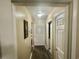 Clean hallway featuring neutral walls, white doors, and modern flooring at 3677 Claypond Village Ln. # 4, Myrtle Beach, SC 29572