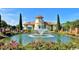 Beautiful water fountain in a garden-style pond with lush landscaping and decorative flowers at 381 Starlit Way, Myrtle Beach, SC 29579