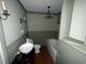 Bathroom featuring a chandelier, sink vanity, and bathtub at 402 Wilkinson St., Georgetown, SC 29440