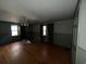 Living room featuring hardwood floors, neutral walls, and multiple windows at 402 Wilkinson St., Georgetown, SC 29440