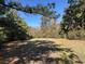 Landscaped lot with mature trees that offers privacy and natural beauty at 402 Wilkinson St., Georgetown, SC 29440