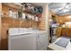 Laundry room with a washer, dryer, shelving, and partial kitchen view at 408 Sunset Trail, Myrtle Beach, SC 29577