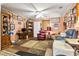 Living room with carpet, ceiling fan, and lots of framed photos on the wall at 408 Sunset Trail, Myrtle Beach, SC 29577