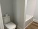 This bathroom features a white low-flow toilet and a white tub with a shower at 415 Circle Dr., Johnsonville, SC 29555