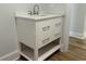 Bathroom featuring a white vanity with a quartz countertop, undermount sink, and chrome faucet at 415 Circle Dr., Johnsonville, SC 29555