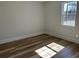 Bedroom with wood-look flooring and neutral wall paint and window at 415 Circle Dr., Johnsonville, SC 29555