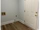 Laundry room with wood-look flooring and neutral wall paint at 415 Circle Dr., Johnsonville, SC 29555