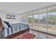 Bedroom with wood floors, natural light, and shuttered windows at 423 Parker Dr. # 306, Pawleys Island, SC 29585