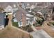 Aerial view of home showcasing the surrounding landscape, deck, chimney, and patio seating at 4305 Frontier Dr., Myrtle Beach, SC 29577