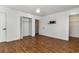 Bedroom featuring hardwood floors, ceiling fan, and closet with white paneled doors at 4305 Frontier Dr., Myrtle Beach, SC 29577