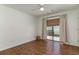 Bedroom with hardwood floors and sliding door leading to outside patio at 4305 Frontier Dr., Myrtle Beach, SC 29577