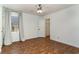 A bright bedroom featuring modern ceiling fan, wood floors, and closet at 4305 Frontier Dr., Myrtle Beach, SC 29577