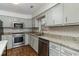 Updated kitchen featuring stainless steel appliances, granite countertops and updated cabinetry at 4305 Frontier Dr., Myrtle Beach, SC 29577