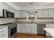 Updated kitchen featuring stainless steel appliances, granite countertops and updated cabinetry at 4305 Frontier Dr., Myrtle Beach, SC 29577