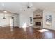 Inviting living room with fireplace, wood floors, and easy access to the kitchen and outdoor space at 4305 Frontier Dr., Myrtle Beach, SC 29577