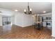 Open-concept living area connects to modern kitchen with stainless steel appliances and island at 4305 Frontier Dr., Myrtle Beach, SC 29577