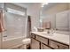 This bathroom features a shower-tub combo with a white surround and vanity with a solid surface countertop at 477 Cane Branch Rd., Loris, SC 29569