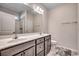 Bathroom featuring a double sink vanity, ample counter space, and modern fixtures at 477 Cane Branch Rd., Loris, SC 29569