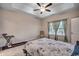 Comfortable bedroom with a ceiling fan, carpeting, and a bright, inviting atmosphere at 477 Cane Branch Rd., Loris, SC 29569