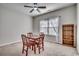 Bedroom with a ceiling fan, carpeting, and a table with chairs by the window at 477 Cane Branch Rd., Loris, SC 29569