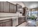 Modern kitchen with granite countertops, stainless steel appliances, and wood-look flooring at 477 Cane Branch Rd., Loris, SC 29569