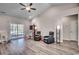 Spacious living room featuring vaulted ceilings, luxury vinyl plank flooring, and lots of natural light at 477 Cane Branch Rd., Loris, SC 29569