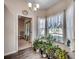 Bright sunroom filled with natural light, featuring numerous plants and serene outdoor views at 477 Cane Branch Rd., Loris, SC 29569